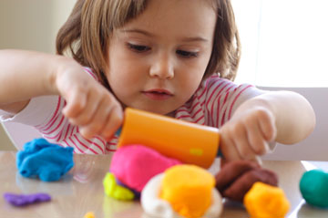 Girl playing with plastacine